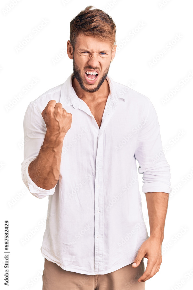 Young caucasian man wearing casual clothes angry and mad raising fist frustrated and furious while shouting with anger. rage and aggressive concept. Young caucasian man wearing casual clothes angry and mad raising fist frustrated and furious while shouting with anger. rage and aggressive concept.
