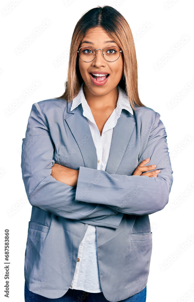 Young hispanic business woman wearing business shirt and glasses celebrating crazy and amazed for success with open eyes screaming excited. Young hispanic business woman wearing business shirt and glasses celebrating crazy and amazed for success with open eyes screaming excited.