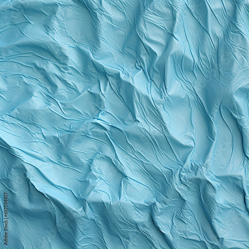 Photograph of a light blue hue wave pattern textured background with empty space for text