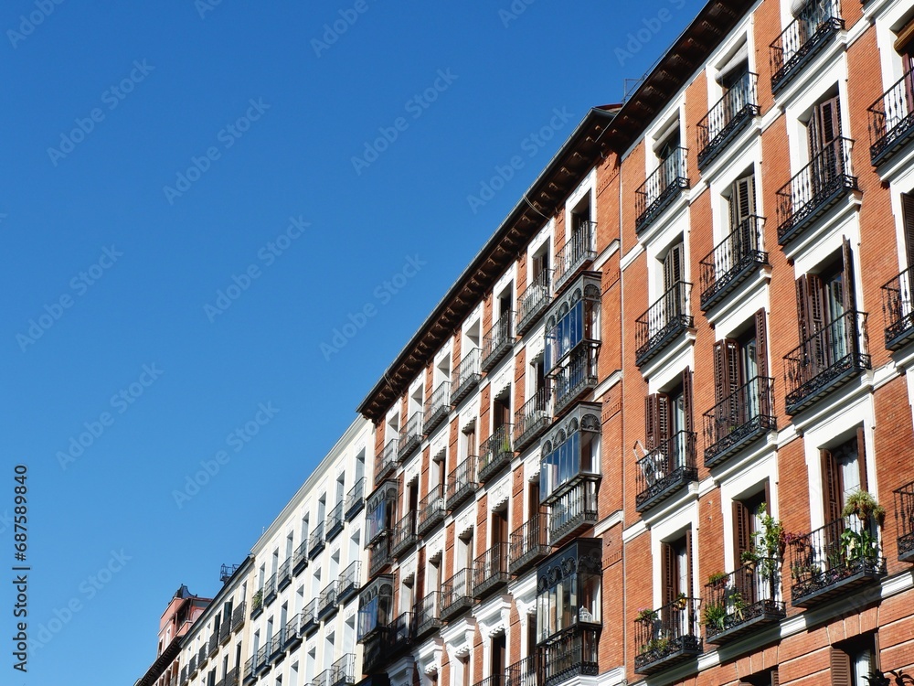Vintage facades with windows and balconies downtown Madrid, central district, Spain
