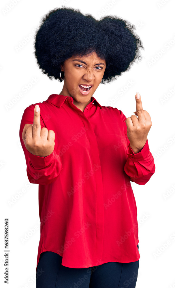 Young african american girl wearing casual clothes showing middle finger doing fuck you bad expression, provocation and rude attitude. screaming excited Young african american girl wearing casual clothes showing middle finger doing fuck you bad expression, provocation and rude attitude. screaming excited