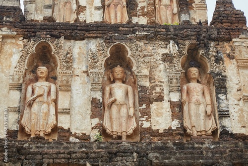 The unique and historic Wat Chama Thewi in Lamphun, Thailand photo