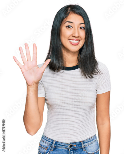 Wallpaper Mural Beautiful asian young woman wearing casual white t shirt showing and pointing up with fingers number five while smiling confident and happy. Torontodigital.ca