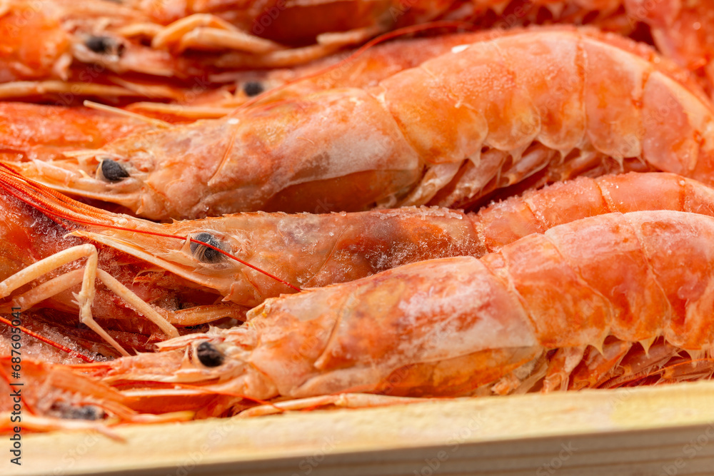 Frozen king prawns, sea food in wooden box Frozen king prawns, sea food in wooden box