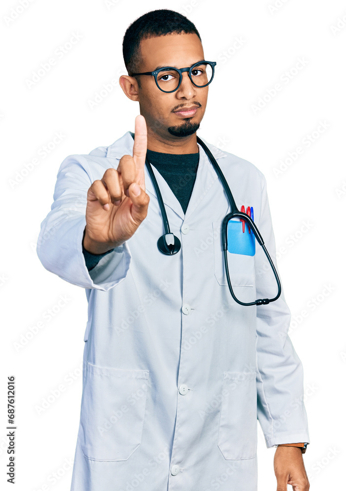 Young african american man wearing doctor uniform and stethoscope pointing with finger up and angry expression, showing no gesture Young african american man wearing doctor uniform and stethoscope pointing with finger up and angry expression, showing no gesture