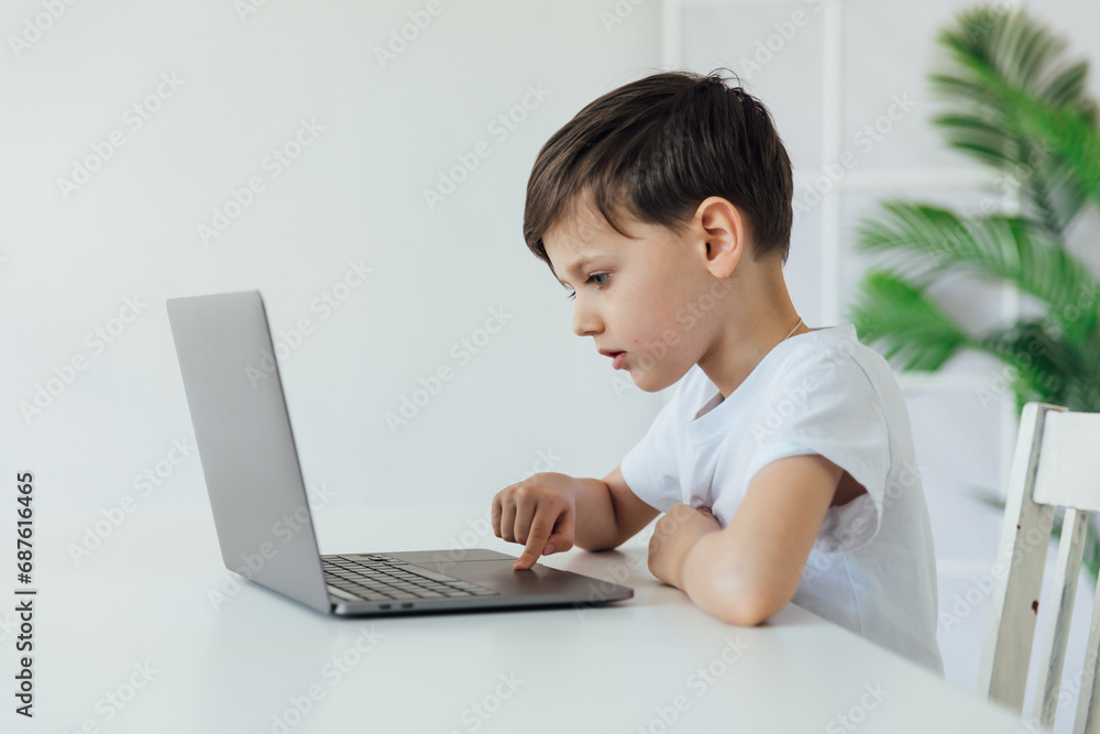 homeschooling student education lessons boy schoolboy learns at the computer online school in the classroom homeschooling student education lessons boy schoolboy learns at the computer online school in the classroom
