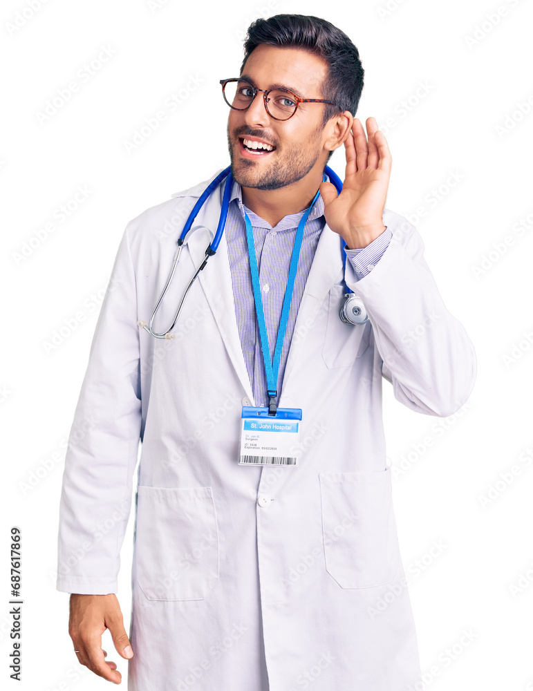 Young hispanic man wearing doctor uniform and stethoscope smiling with hand over ear listening an hearing to rumor or gossip. deafness concept. Young hispanic man wearing doctor uniform and stethoscope smiling with hand over ear listening an hearing to rumor or gossip. deafness concept.