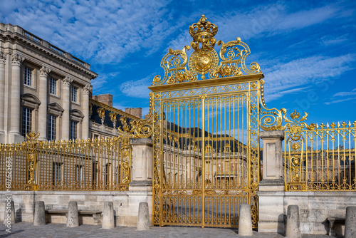 Golden entry gates of Chateau De Versailles photo