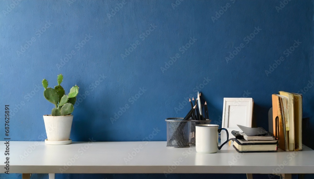 home office desk with blue wall and white table mock up home office desk with blue wall and white table mock up