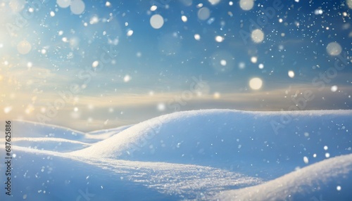 winter snow background with snowdrifts with beautiful light and snow flakes on the blue sky in the evening banner format copy space