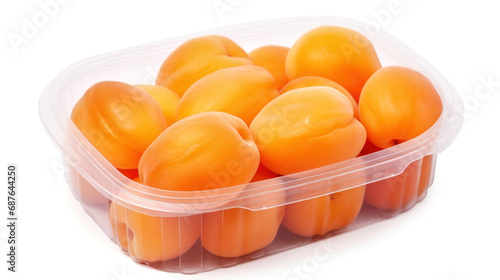 A Close-Up Photo of Ripe Apricots in a Clear Plastic Container