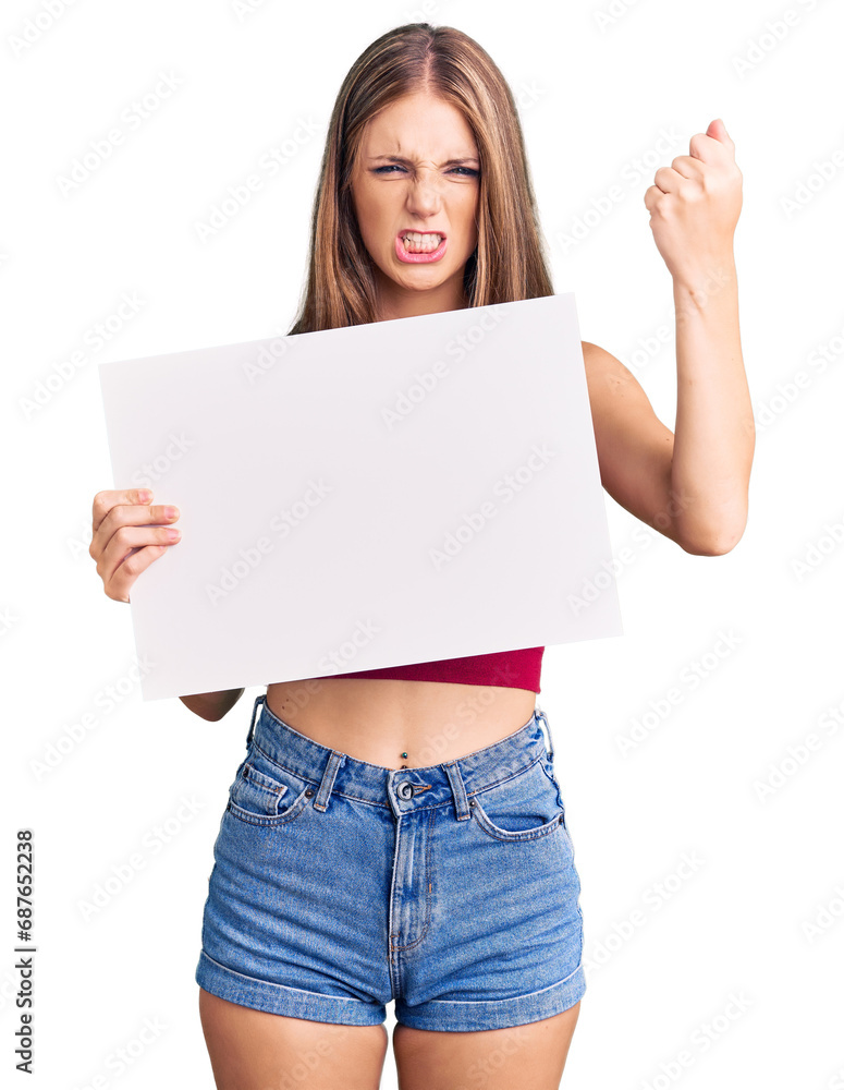Young beautiful blonde woman holding blank empty banner annoyed and frustrated shouting with anger, yelling crazy with anger and hand raised Young beautiful blonde woman holding blank empty banner annoyed and frustrated shouting with anger, yelling crazy with anger and hand raised