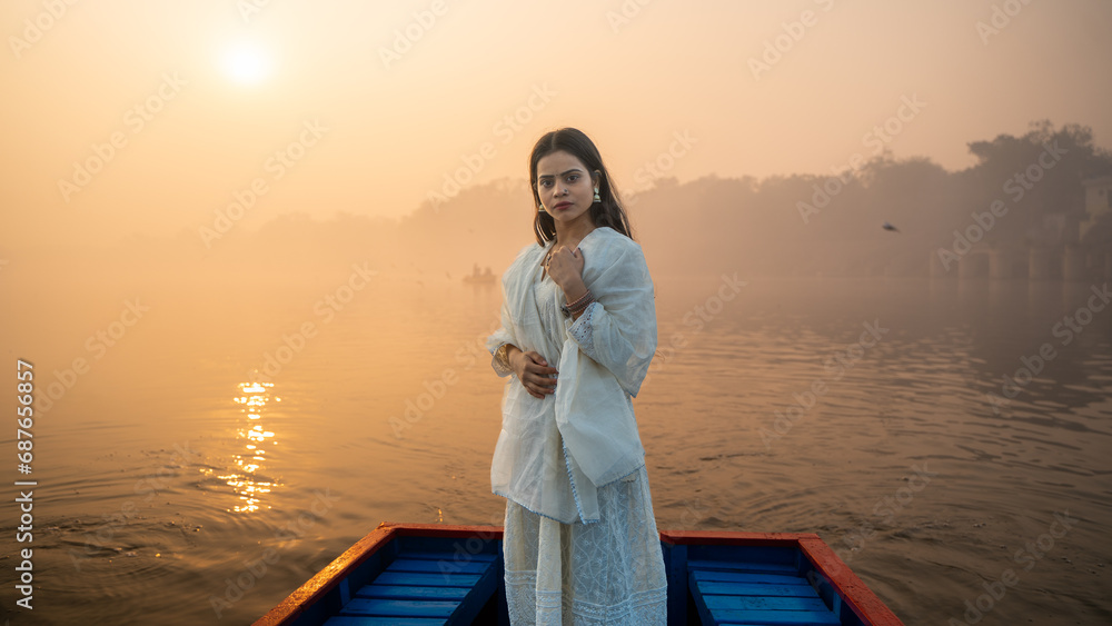 Portrait of a beautiful Indian girl, wearing traditional dress, outdoor nature background Portrait of a beautiful Indian girl, wearing traditional dress, outdoor nature background