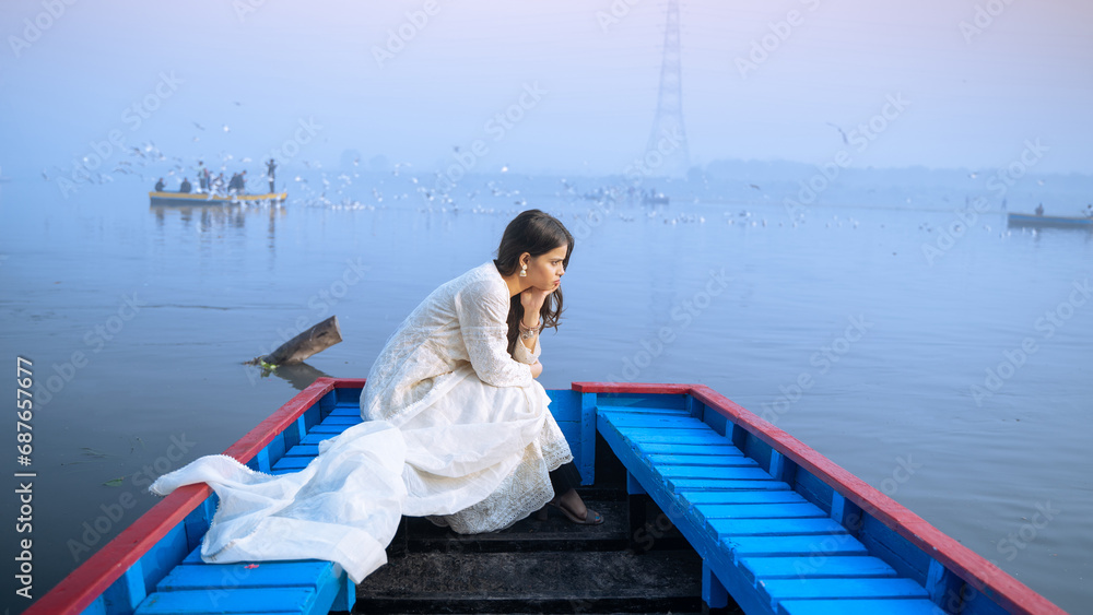 Portrait of a beautiful Indian girl, wearing traditional dress, outdoor nature background Portrait of a beautiful Indian girl, wearing traditional dress, outdoor nature background