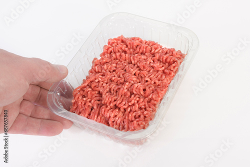 Ground beef in store-bought transparent plastic packaging. close up