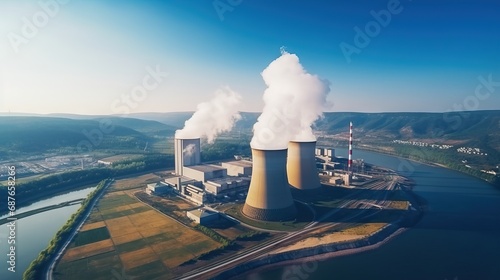 An overhead image of a power plant releasing smoke, depicting industrial operations