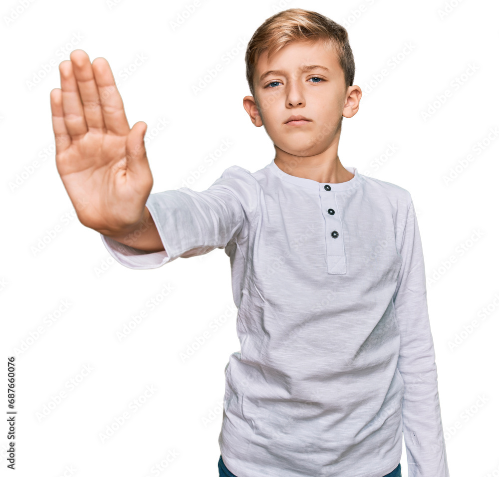 Little caucasian boy kid wearing casual clothes doing stop sing with palm of the hand. warning expression with negative and serious gesture on the face. Little caucasian boy kid wearing casual clothes doing stop sing with palm of the hand. warning expression with negative and serious gesture on the face.