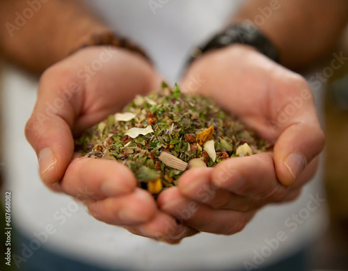 Cupped hands holding chopped herbs