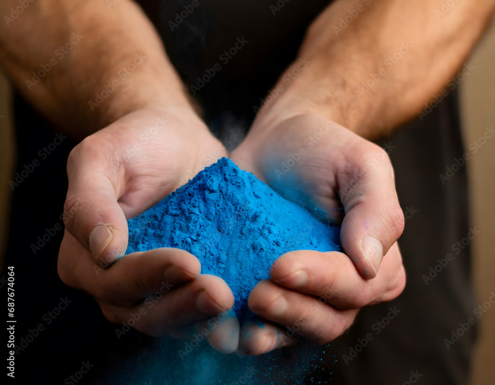 Close-up of hands holding blue powder Close-up of hands holding blue powder