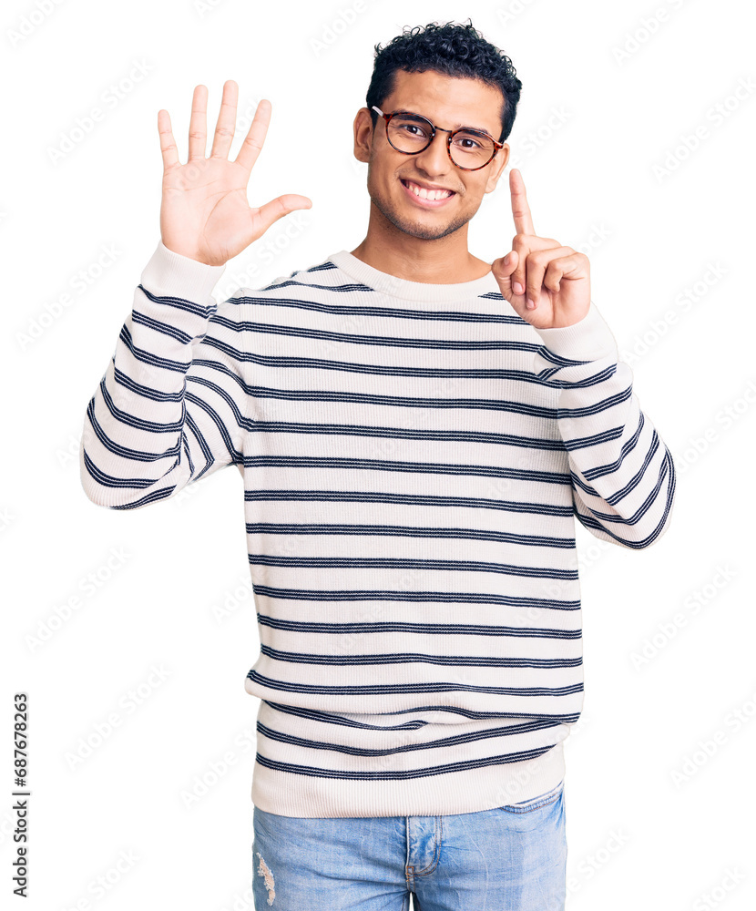 Hispanic handsome young man wearing casual clothes and glasses showing and pointing up with fingers number six while smiling confident and happy. Hispanic handsome young man wearing casual clothes and glasses showing and pointing up with fingers number six while smiling confident and happy.