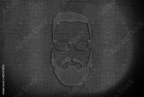 glass head with glasses and a beard on a fabric background