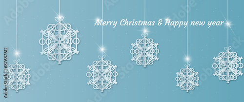  Beautiful paper snowflakes hang on a white thread with a bow  for decoration of backgrounds  cards  web pages.