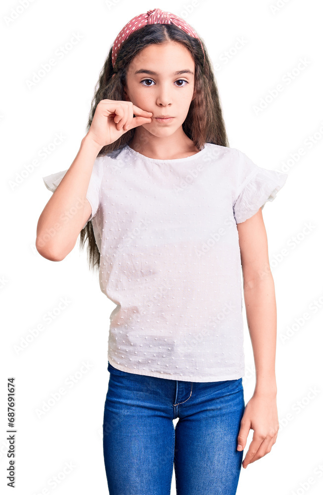 Cute hispanic child girl wearing casual white tshirt mouth and lips shut as zip with fingers. secret and silent, taboo talking Cute hispanic child girl wearing casual white tshirt mouth and lips shut as zip with fingers. secret and silent, taboo talking