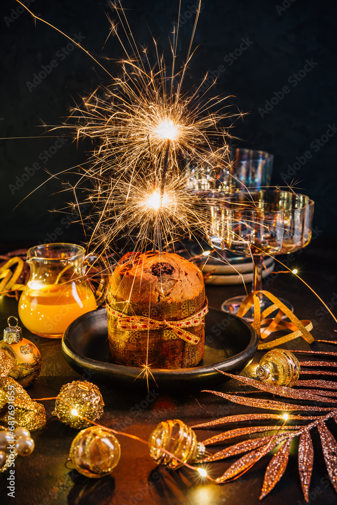 Traditional Christmas panettone with chocolate, traditional Italian cake for Christmas with sparkler