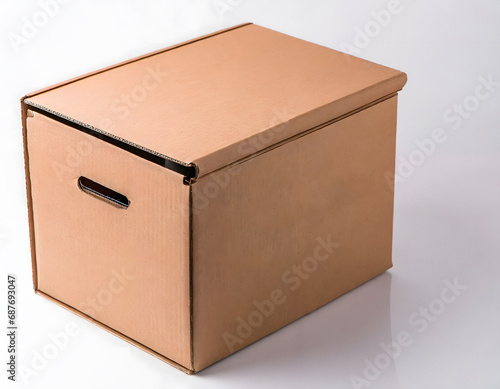 Studio shot of cardboard box with handles © Tim Bird
