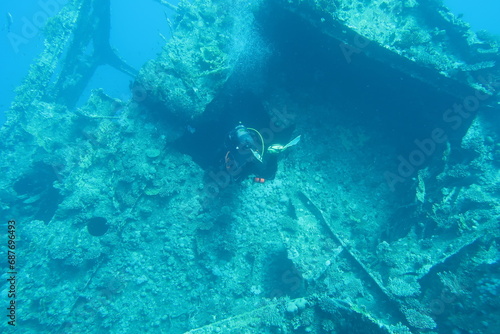 Scuba diver with the wreck of the Giannis D in the Red Sea in Egypt