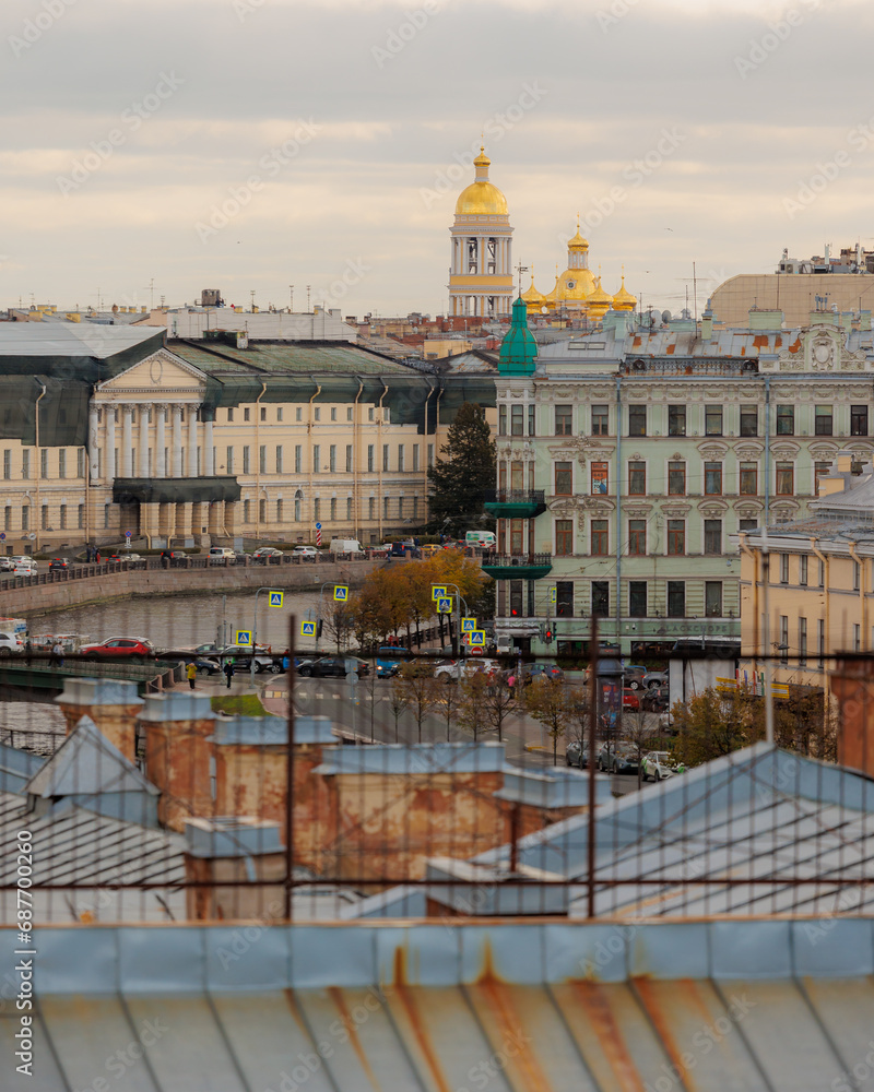 Obraz premium urban landscape, view of embankments and roofs of large metropolis. the old center, cozy streets for walking. Travel tourism, travel guide.