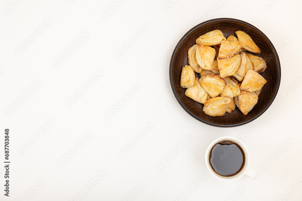 Homemade cookies in a bowl and a cup of black coffee Homemade cookies in a bowl and a cup of black coffee