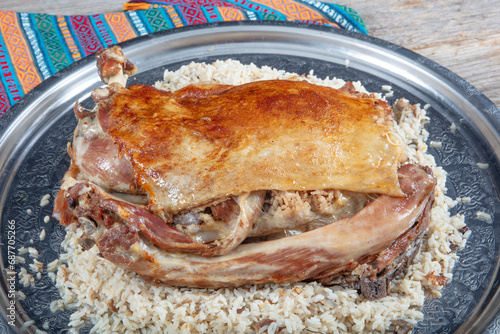 Stuffed lamb ribs. Lamb ribs on rice. Stuffed Ribs isolated on black background. Turkish name; 