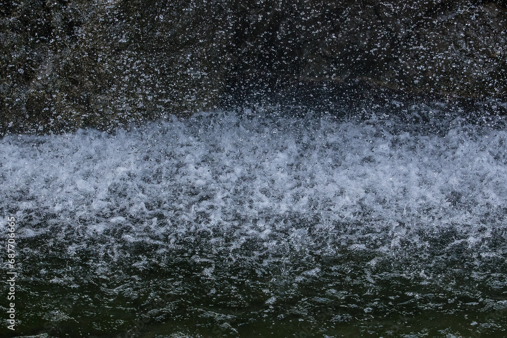 Raindrops falling into the water Raindrops falling into the water