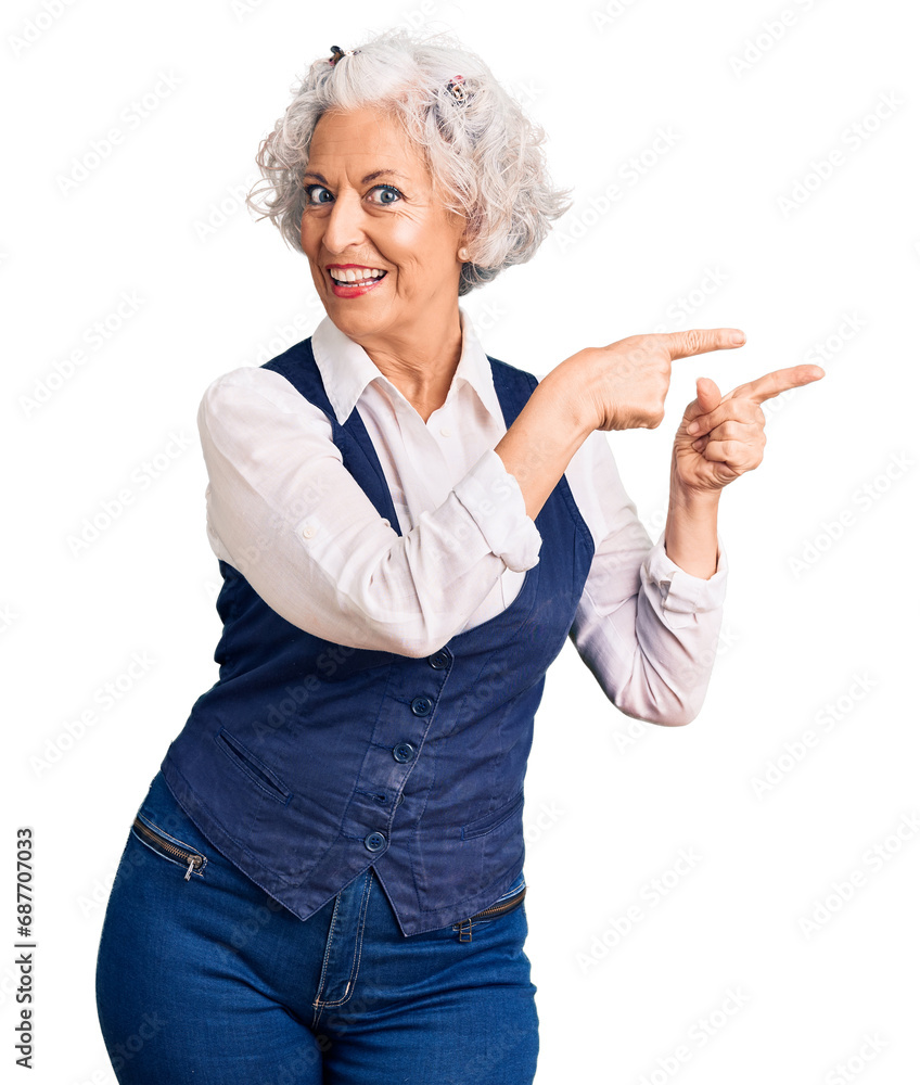 Senior grey-haired woman wearing casual clothes smiling and looking at the camera pointing with two hands and fingers to the side. Senior grey-haired woman wearing casual clothes smiling and looking at the camera pointing with two hands and fingers to the side.
