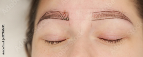Microblading, tiny hair-like strokes to create a natural looking brow, semi-permanent tattooing technique used for the eyebrows by creating an illusion of a more defined and fuller brow.   photo