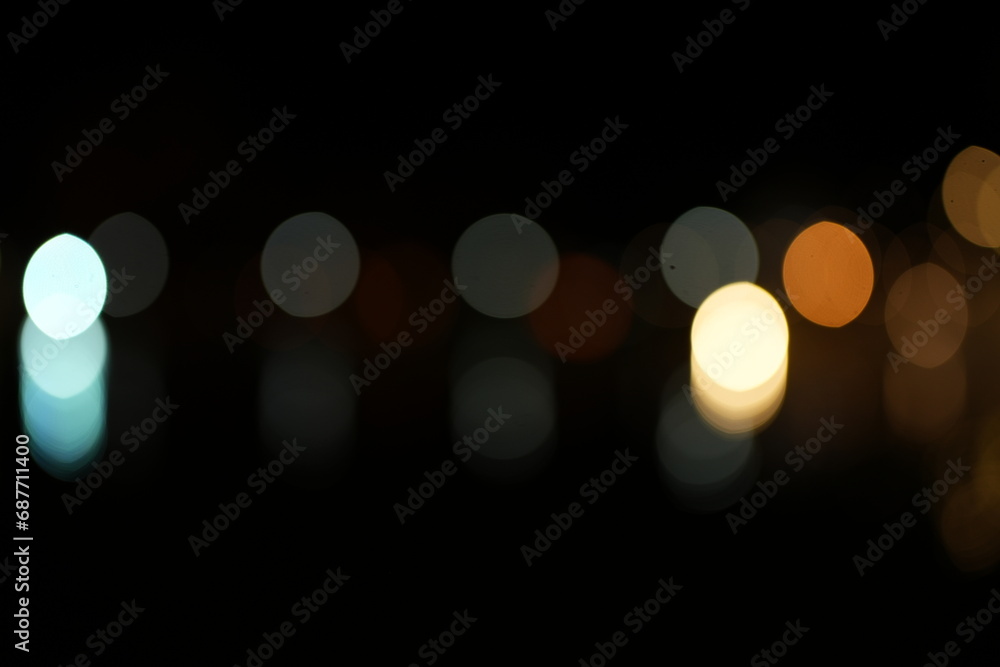 Black background Horizontal background with blur bokeh effects for christmas time. Special occasion concept with space for text. Black background Horizontal background with blur bokeh effects for christmas time. Special occasion concept with space for text.