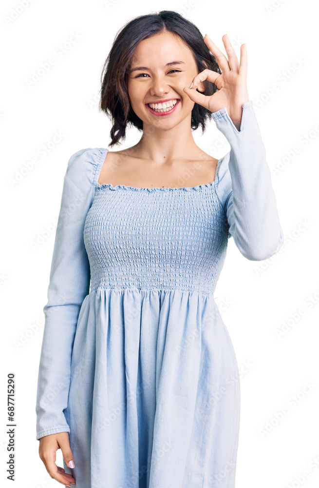 Young beautiful girl wearing casual clothes smiling positive doing ok sign with hand and fingers. successful expression. Young beautiful girl wearing casual clothes smiling positive doing ok sign with hand and fingers. successful expression.
