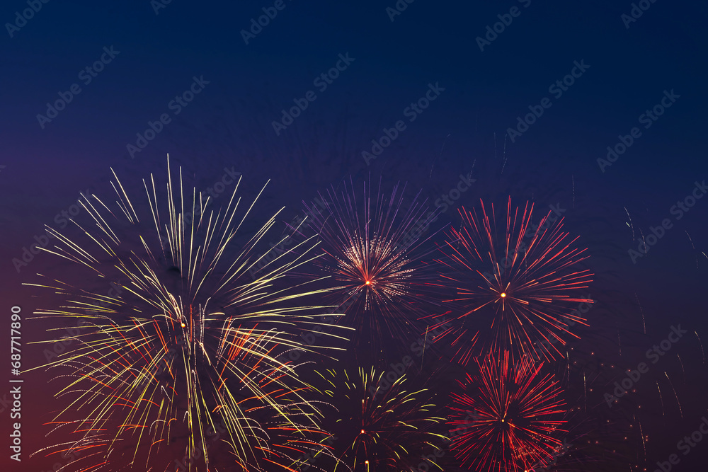 Colorful fireworks on night sky background.