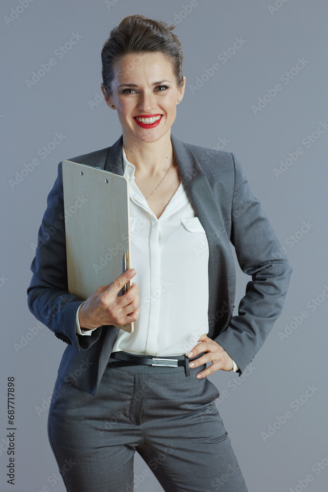smiling modern business woman isolated on grey background smiling modern business woman isolated on grey background