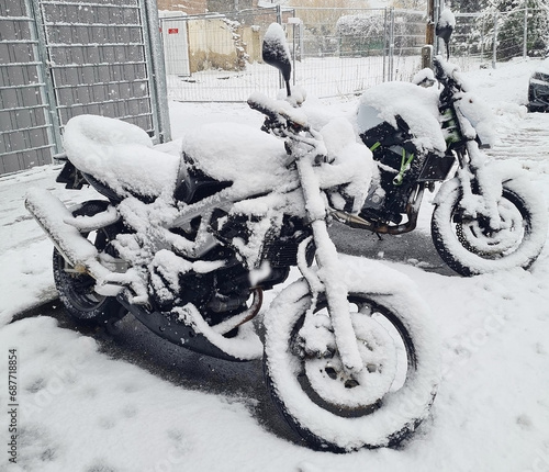 Motorcycle on the street in the snow photo
