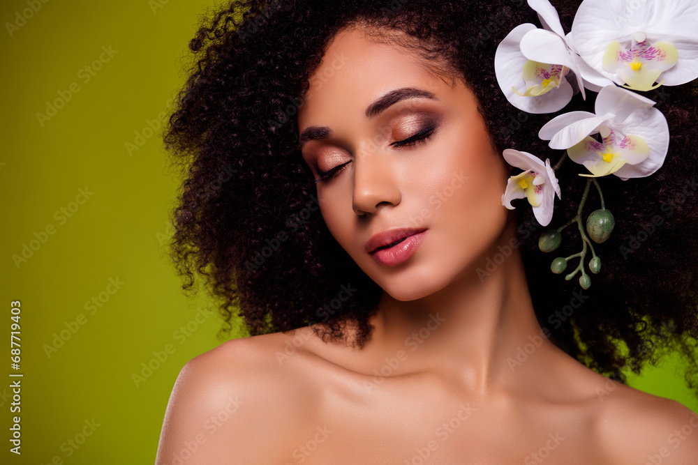 Fototapeta premium Photo of chic stunning girl with flower curls enjoying freshness in lotion essence extract over green background