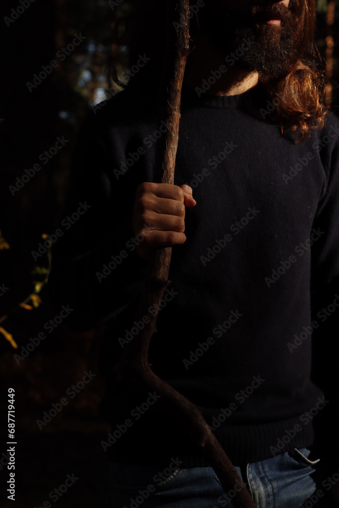 Man holding a stick