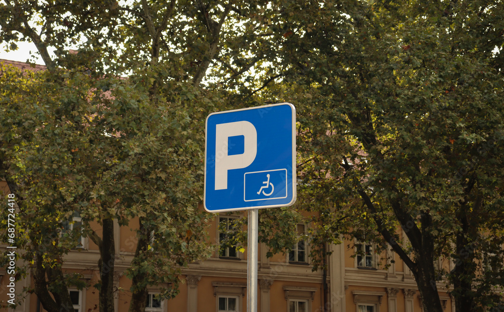 Parking zone sign with wheelchair  for handicapped people. Blue european traffic sign