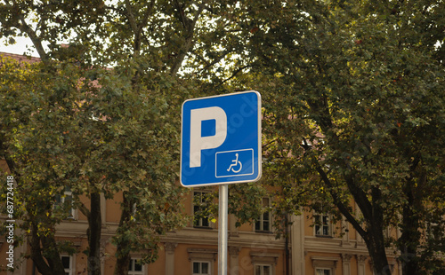 Parking zone sign with wheelchair for handicapped people. Blue european traffic sign