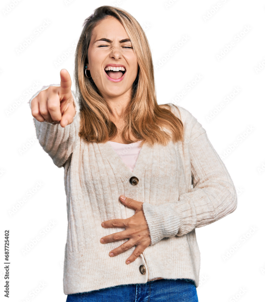 Young blonde woman wearing casual clothes laughing at you, pointing finger to the camera with hand over body, shame expression Young blonde woman wearing casual clothes laughing at you, pointing finger to the camera with hand over body, shame expression