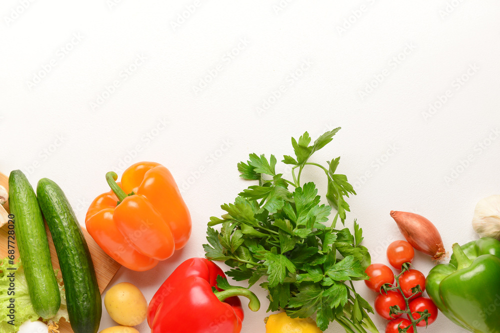 Different fresh vegetables and parsley on white background