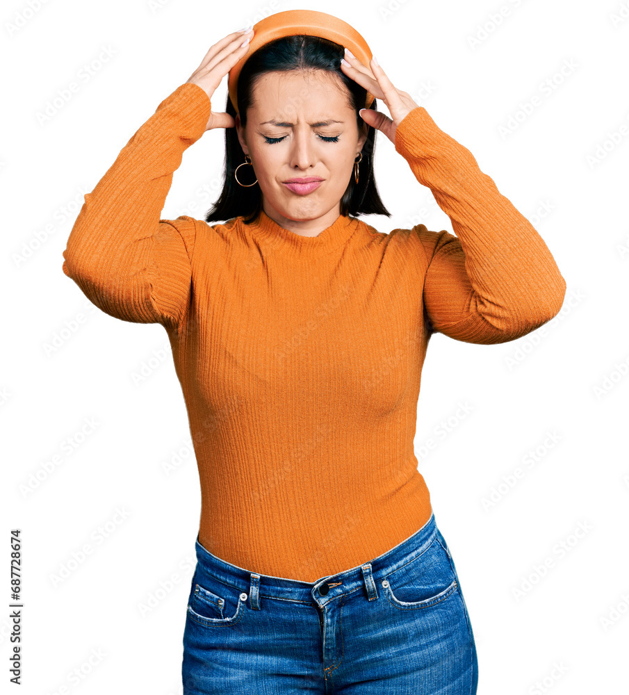 Young hispanic girl wearing casual white t shirt suffering from headache desperate and stressed because pain and migraine. hands on head. Young hispanic girl wearing casual white t shirt suffering from headache desperate and stressed because pain and migraine. hands on head.