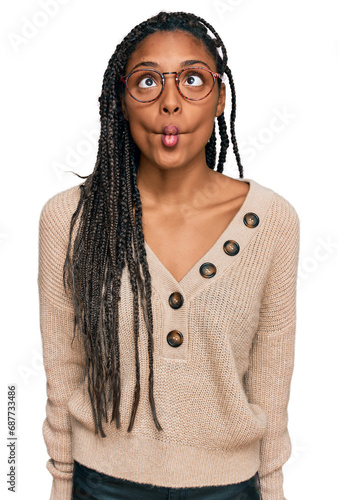 African american woman wearing casual clothes making fish face with lips, crazy and comical gesture. funny expression.