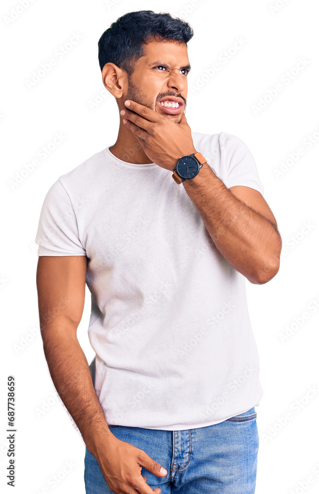 Fototapeta premium Young latin man wearing casual clothes thinking worried about a question, concerned and nervous with hand on chin